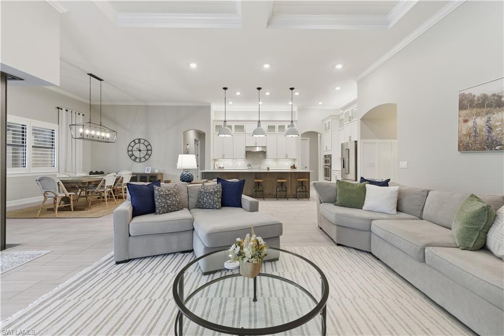 19074 Elston Way Estero, FL 33928 - Photo 24 of 50 a living room with furniture and a chandelier