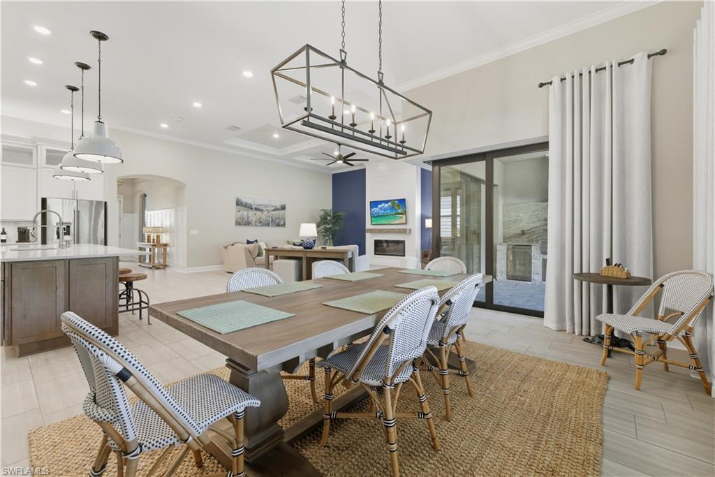 19074 Elston Way Estero, FL 33928 - Photo 26 of 50 a view of a dining room with furniture window and wooden floor