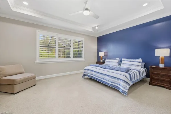 a spacious bedroom with a bed and a couch