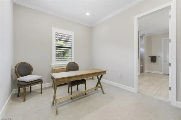 a workspace with furniture and a window