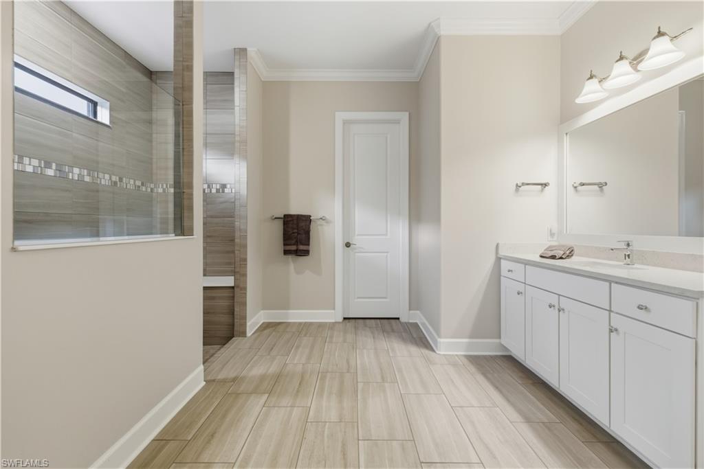 19074 Elston Way Estero, FL 33928 - Photo 33 of 50 a bathroom with a sink and a mirror