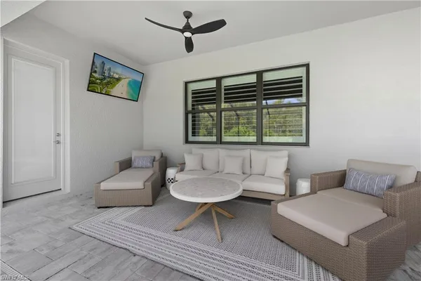 a living room with furniture and a window