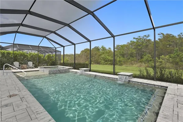 a view of a backyard with sitting area