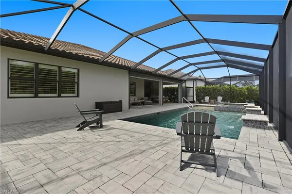 a view of a backyard with sitting area