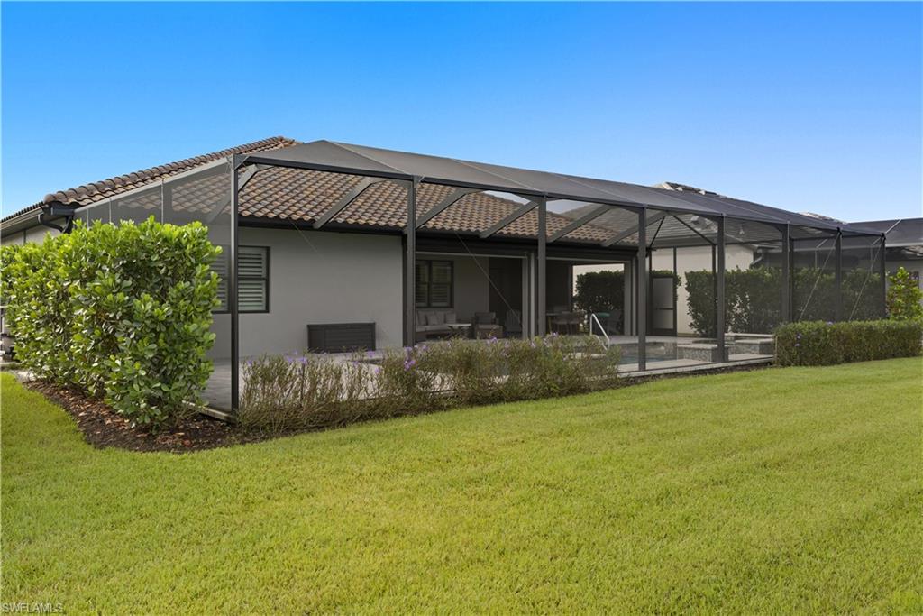 19074 Elston Way Estero, FL 33928 - Photo 43 of 50 a front view of house with yard