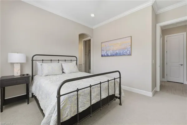 a bedroom with a bed and lamp