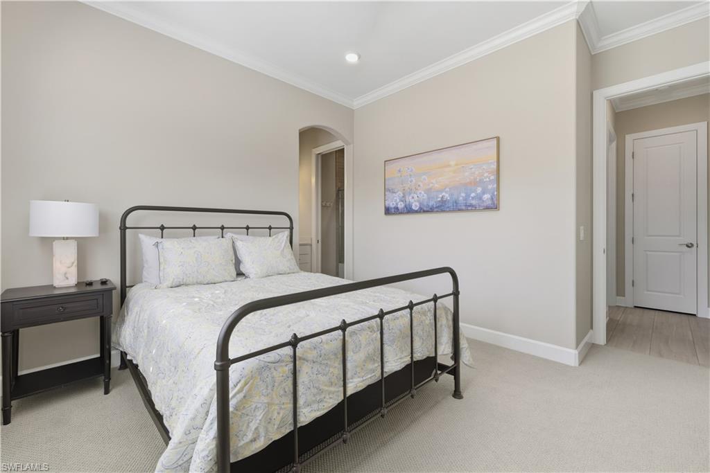 19074 Elston Way Estero, FL 33928 - Photo 6 of 50 a bedroom with a bed and lamp