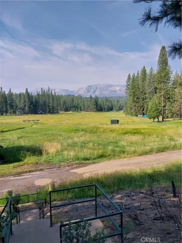 a view of a yard with an outdoor space and seating area