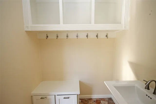 a white bath tub sitting next to a shower