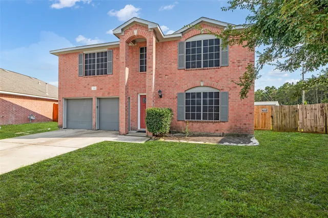 a view of a room with wooden floor and white walls