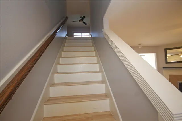 wooden floor in an empty room with a fireplace