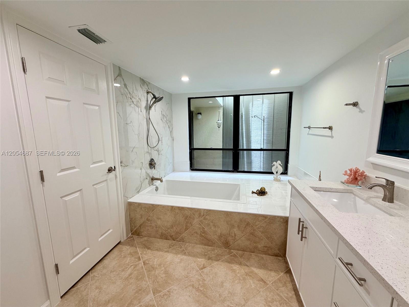 1605 Highway 1, Unit 9B Jupiter, FL 33477 - Photo 9 of 33 spa style bathroom