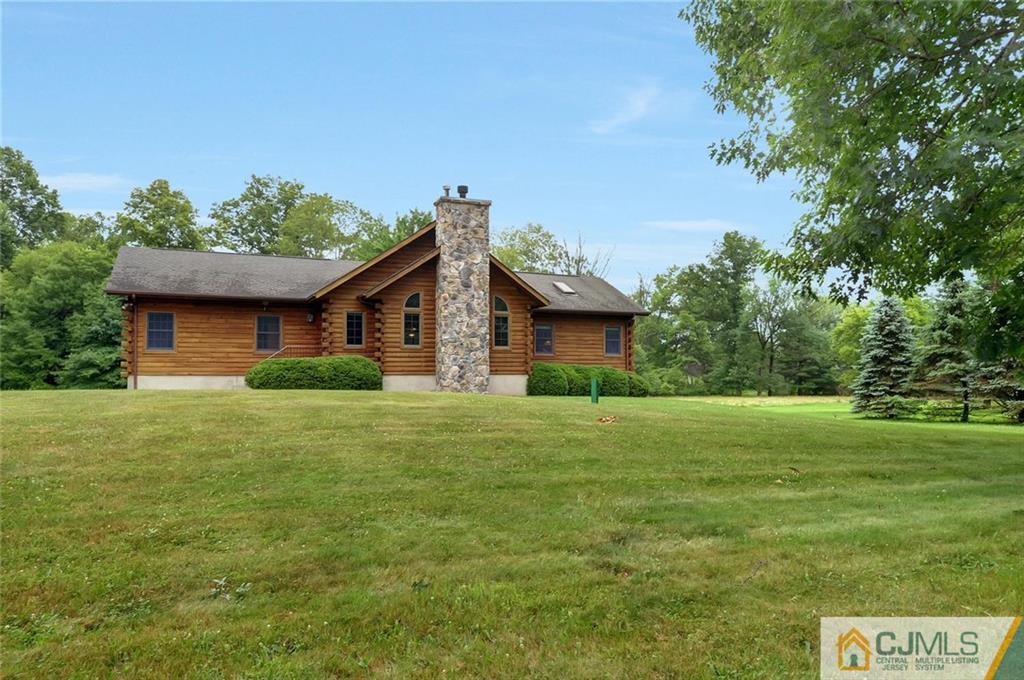 4 Hampton Road Pittstown, NJ 08867 - Photo 2 of 25 a front view of a house with a garden
