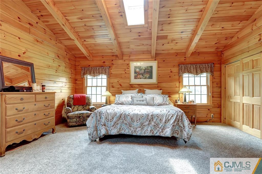 4 Hampton Road Pittstown, NJ 08867 - Photo 16 of 25 a bedroom with a bed and wooden floor