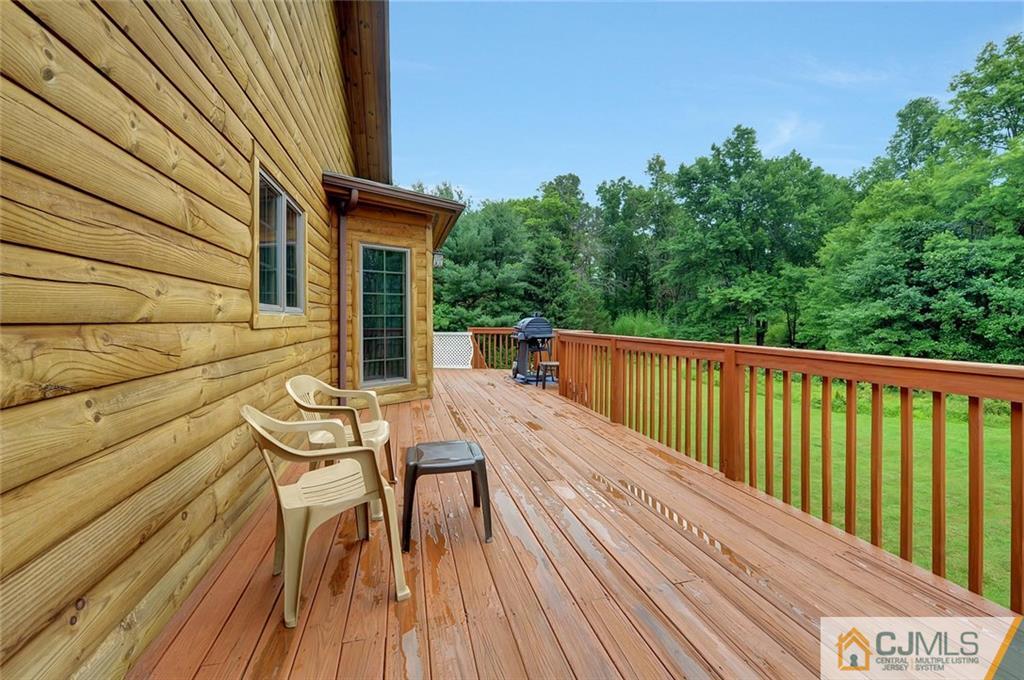 4 Hampton Road Pittstown, NJ 08867 - Photo 21 of 25 a view of balcony with wooden floor and outdoor seating