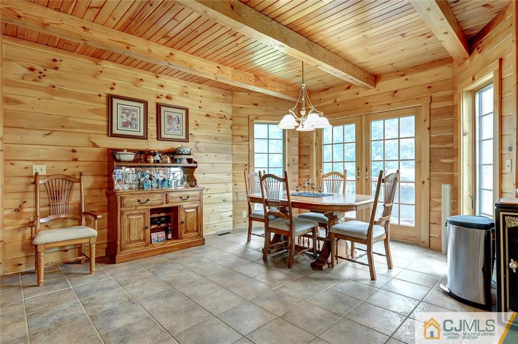 4 Hampton Road Pittstown, NJ 08867 - Photo 10 of 25 a dining room with furniture and a fireplace
