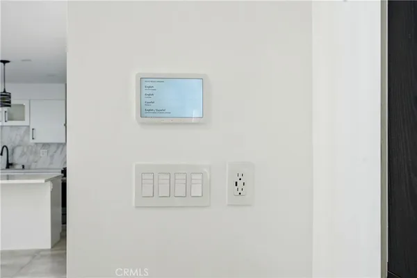 a kitchen with stainless steel appliances kitchen island granite countertop a refrigerator a sink and a stove