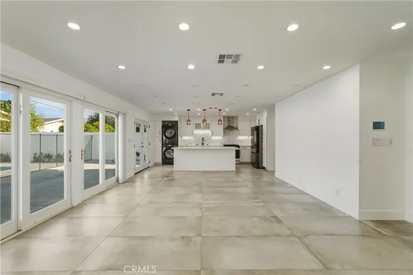 a view of a house with pool fire pit and couches chair