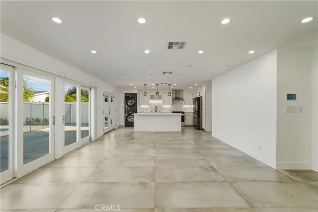 a view of a house with pool fire pit and couches chair