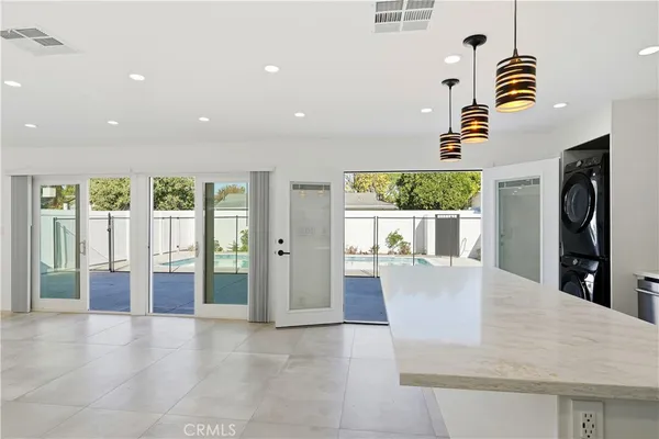 an aerial view of residential houses with yard