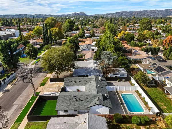an aerial view of residential houses with outdoor space