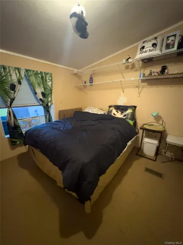 a bedroom with a bed and ceiling fan