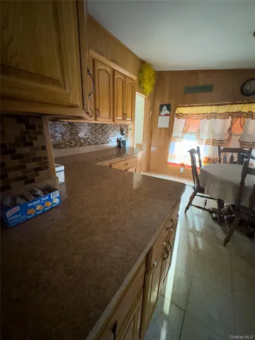 a room with wooden floor and furniture