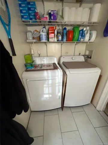 a utility room with washer and dryer