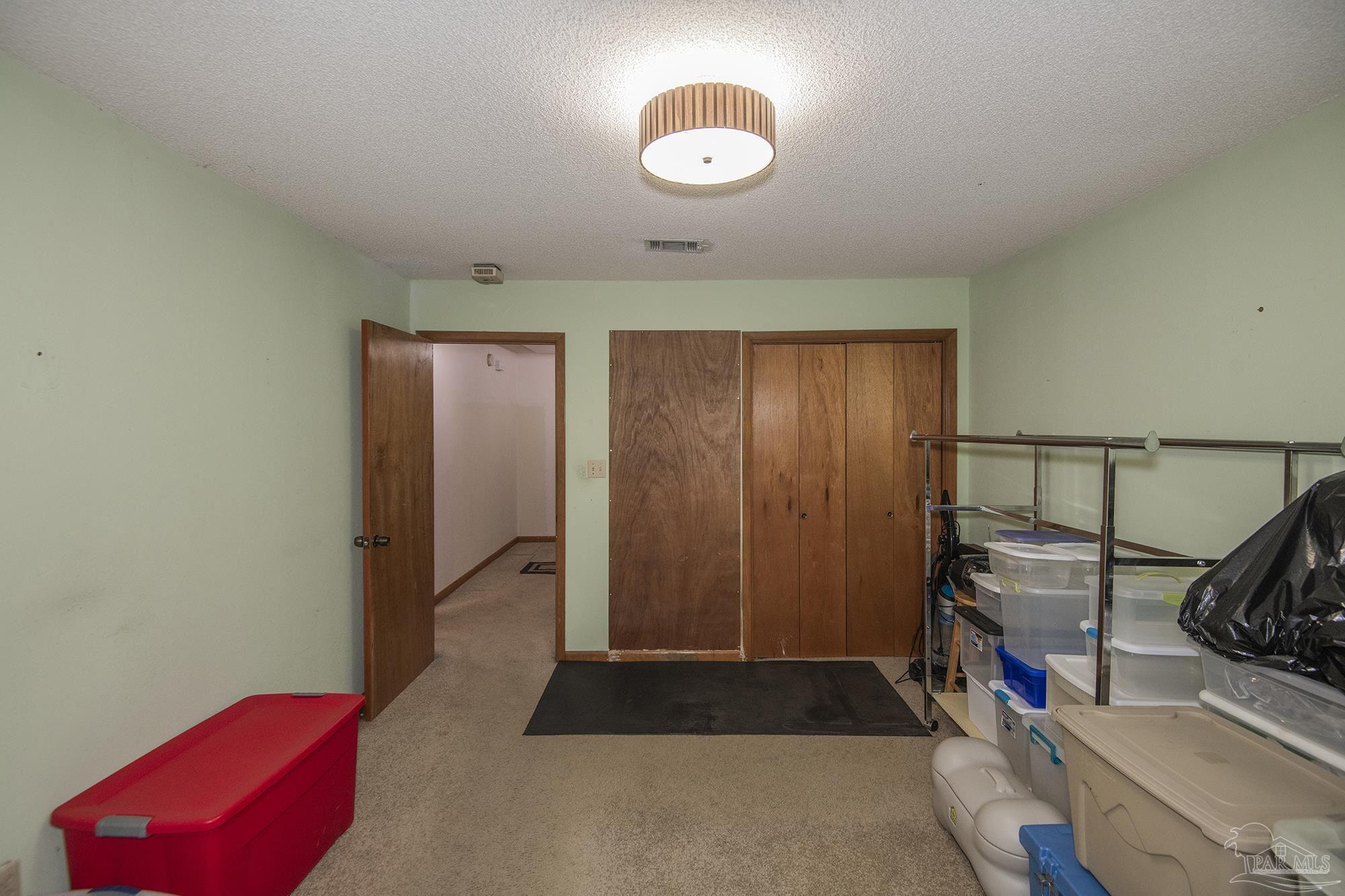 1210 Goldenrod Road Cantonment, FL 32533 - Photo 27 of 50 a view of a storage & utility room