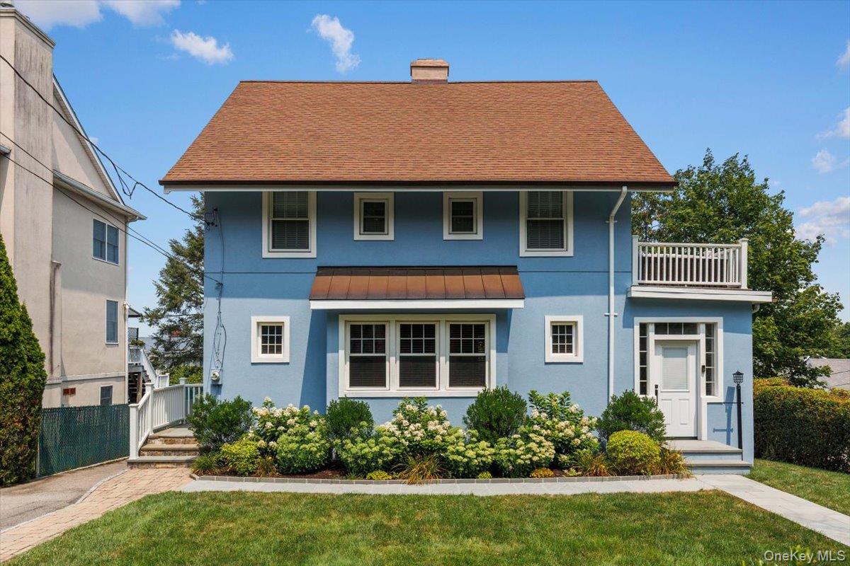 13 Harrison Street Tuckahoe, NY 10707 - Photo 1 of 44 a front view of a house with a yard and potted plants