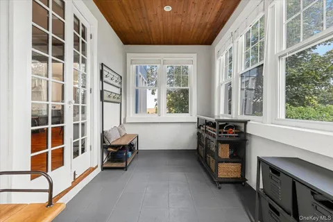 a view of a bedroom with furniture and a window