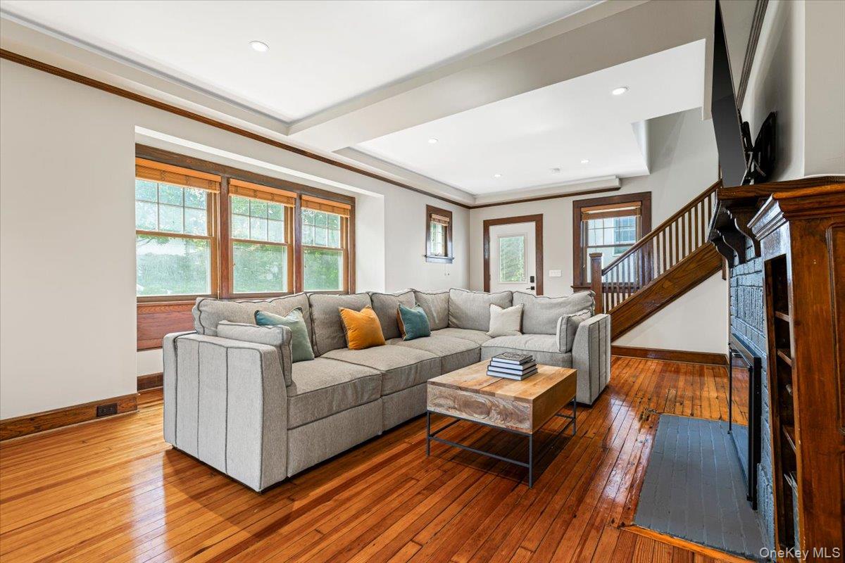 13 Harrison Street Tuckahoe, NY 10707 - Photo 13 of 44 a living room with furniture a large window and wooden floor