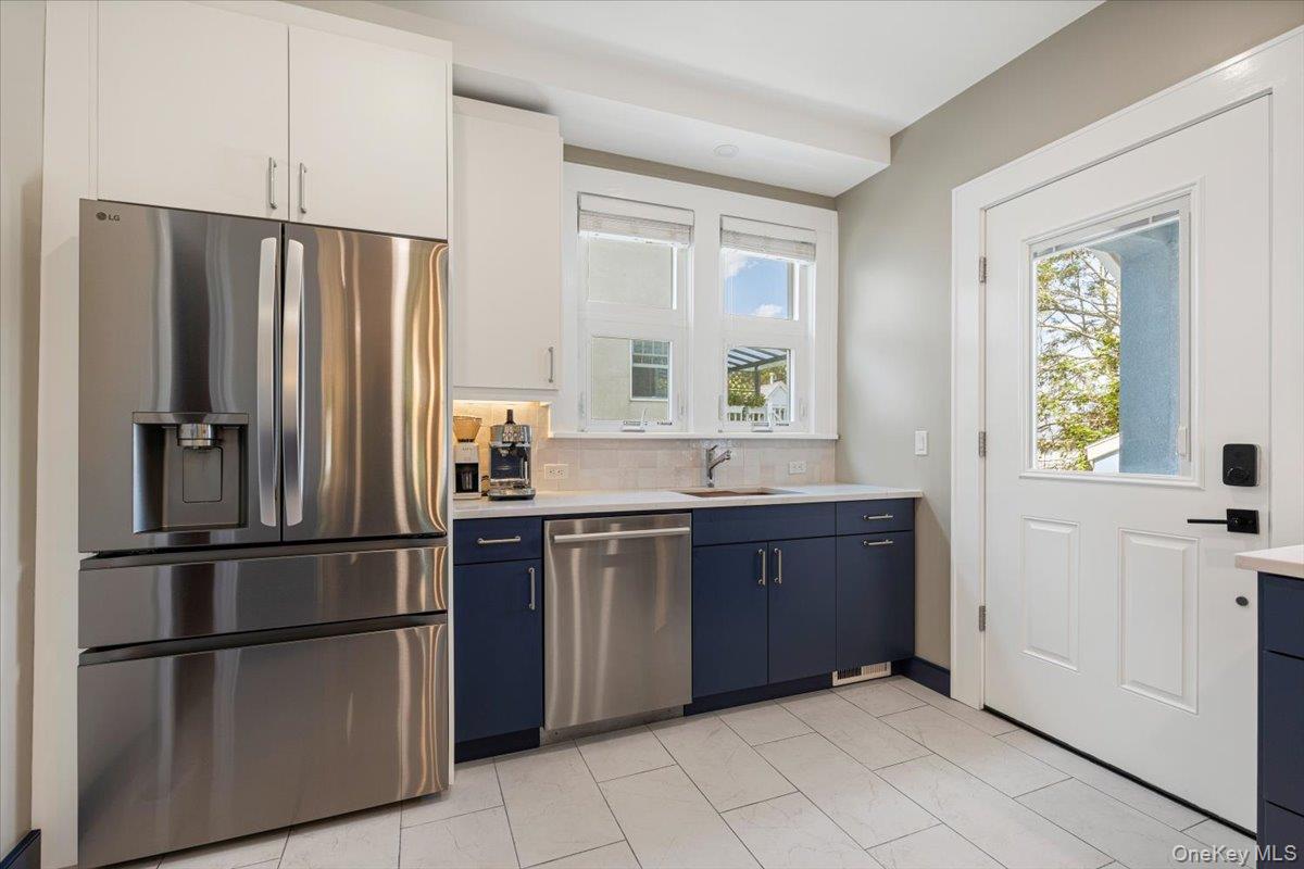 13 Harrison Street Tuckahoe, NY 10707 - Photo 22 of 44 a kitchen with stainless steel appliances granite countertop a refrigerator and a sink