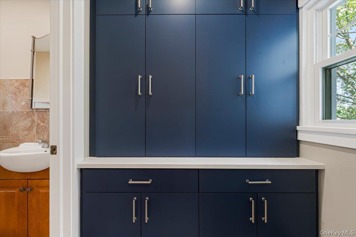 13 Harrison Street Tuckahoe, NY 10707 - Photo 23 of 44 a bathroom with a sink vanity and a mirror