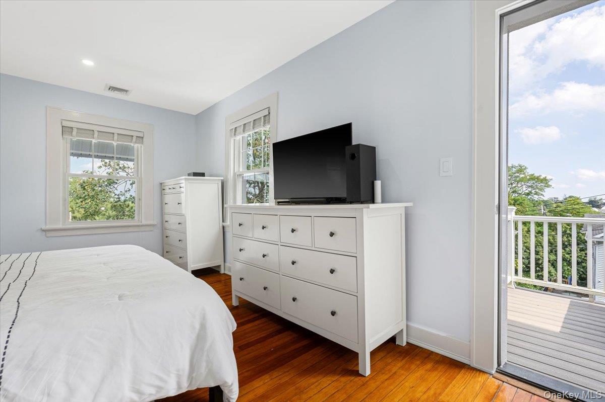 13 Harrison Street Tuckahoe, NY 10707 - Photo 26 of 44 a bedroom with a bed and a flat screen tv