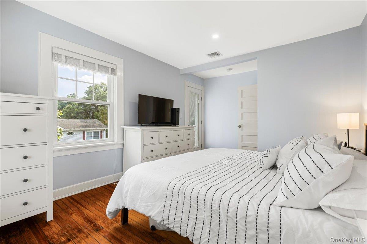 13 Harrison Street Tuckahoe, NY 10707 - Photo 27 of 44 a bedroom with a bed and a flat tv screen in it