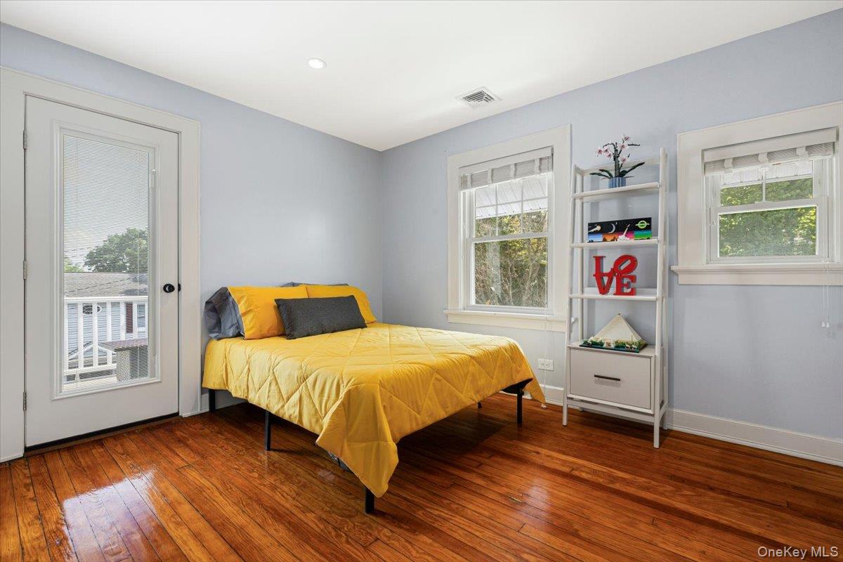13 Harrison Street Tuckahoe, NY 10707 - Photo 32 of 44 a bedroom with a bed and wooden floor