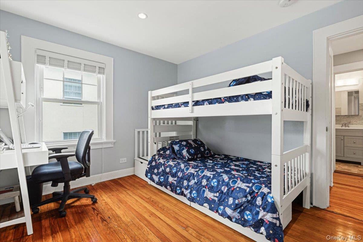 13 Harrison Street Tuckahoe, NY 10707 - Photo 33 of 44 a bedroom with a bed and chair
