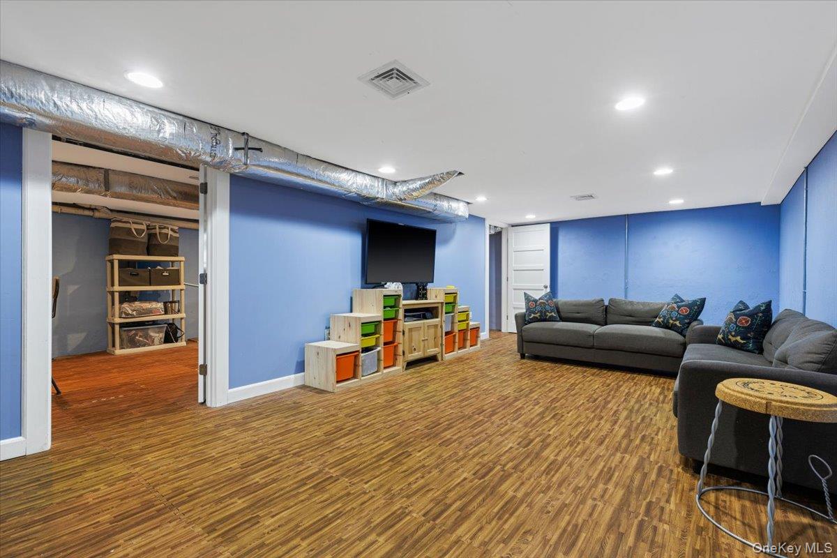 13 Harrison Street Tuckahoe, NY 10707 - Photo 37 of 44 a living room with furniture and a flat screen tv