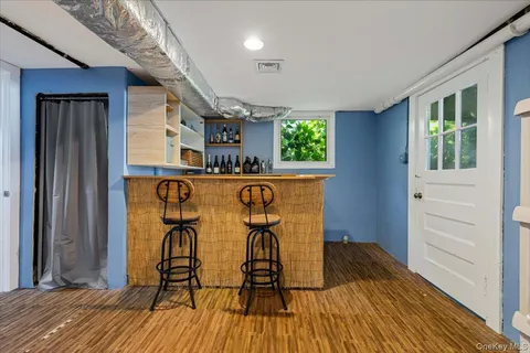 a view of a dining room with furniture and a window