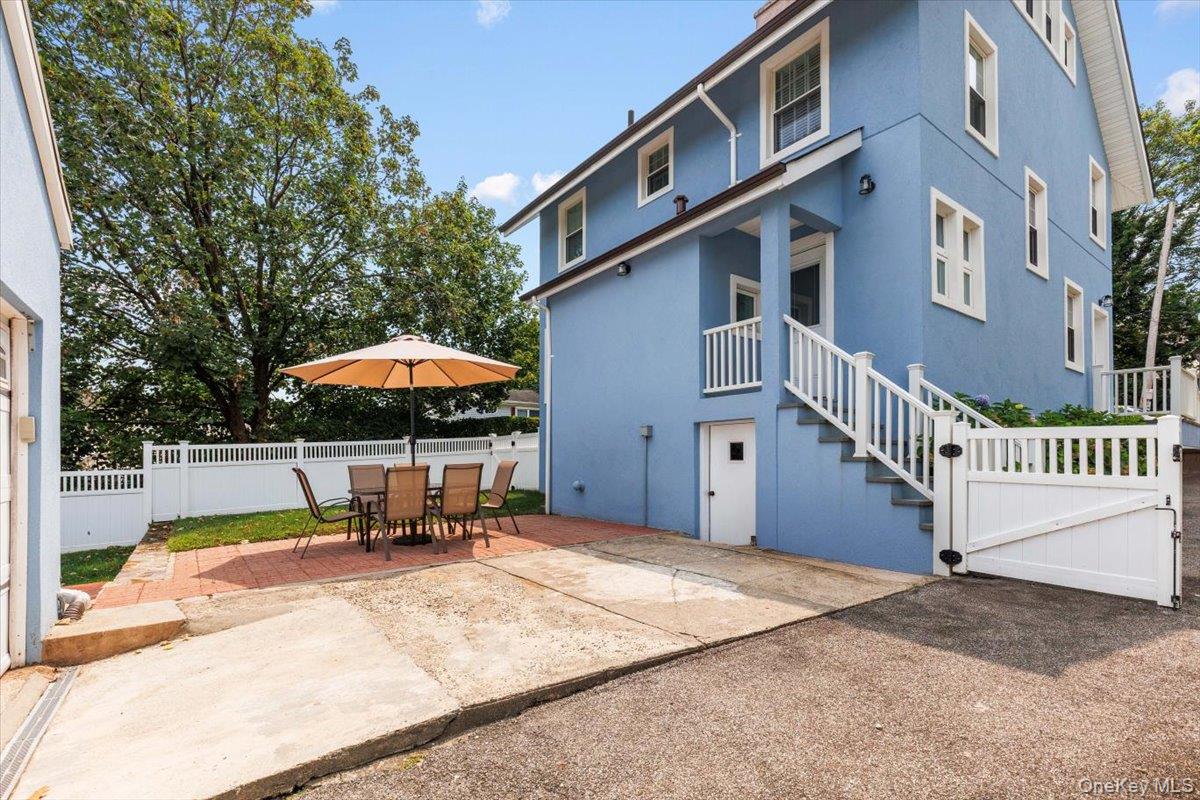 13 Harrison Street Tuckahoe, NY 10707 - Photo 6 of 44 a backyard of a house with table and chairs