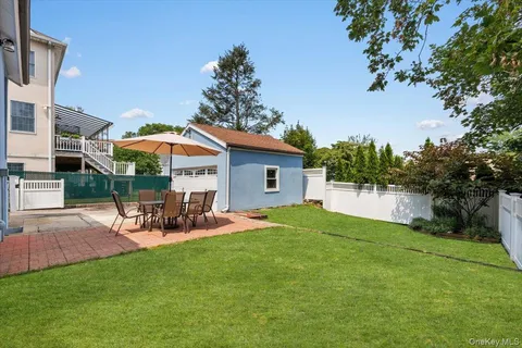 a view of a house with a yard porch and sitting area
