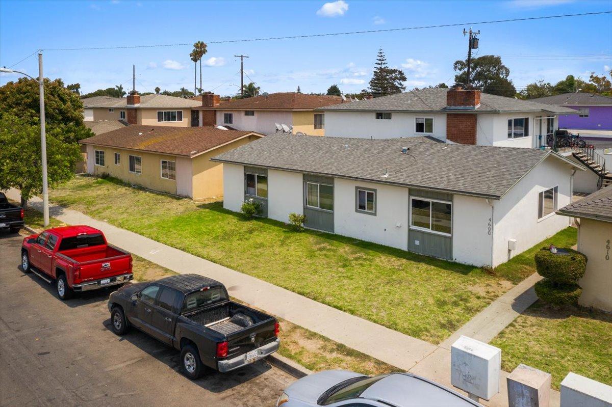4600 Cloyne Street Oxnard, CA 93033 - Photo 2 of 6 a car parked in front of a house with a yard