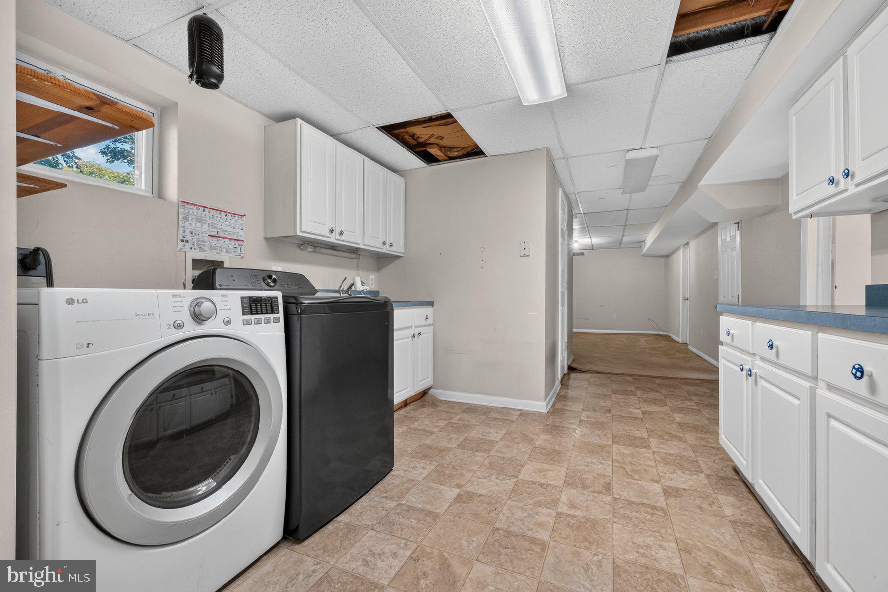 7738 Notley Road Pasadena, MD 21122 - Photo 22 of 25 Spacious laundry area with natural light.