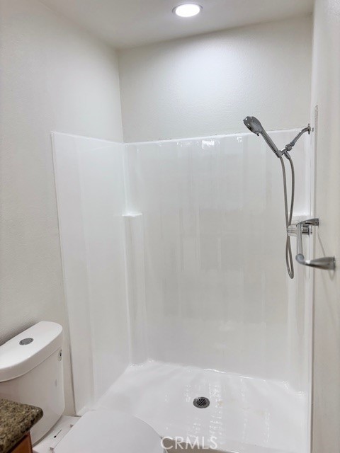 23302 Marigold Avenue, Unit Y204 Torrance, CA 90502 - Photo 14 of 16 a bathroom with a shower and toilet