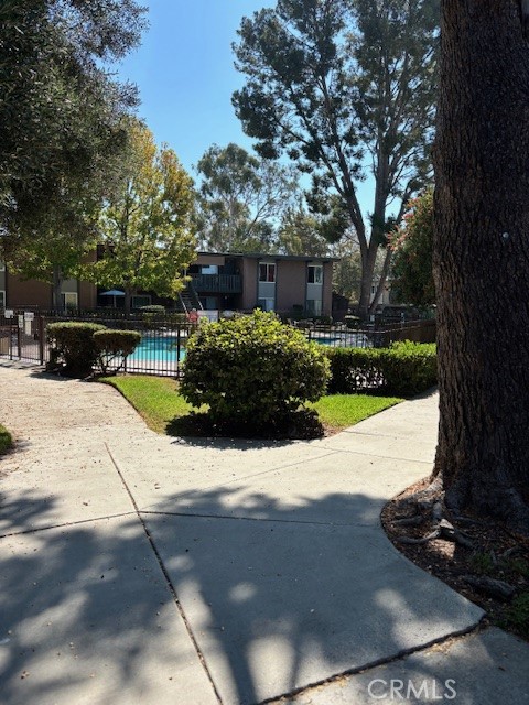 23302 Marigold Avenue, Unit Y204 Torrance, CA 90502 - Photo 16 of 16 a view of a garden with a bench