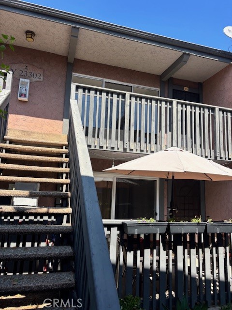 23302 Marigold Avenue, Unit Y204 Torrance, CA 90502 - Photo 2 of 16 a view of a chairs and tables in the patio
