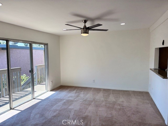 23302 Marigold Avenue, Unit Y204 Torrance, CA 90502 - Photo 6 of 16 wooden floor in an empty room with a window