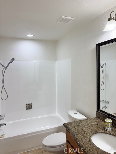 23302 Marigold Avenue, Unit Y204 Torrance, CA 90502 - Photo 7 of 16 a bathroom with a granite countertop sink toilet a mirror and shower