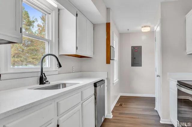 a kitchen with a sink and a window